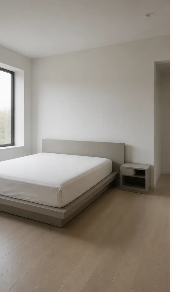 Unedited neutral bedroom with a platform bed and simple bedside table